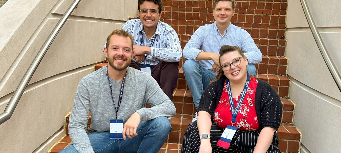 Five Jars team posing by brick stairs